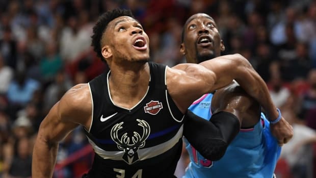 Milwaukee Bucks forward Giannis Antetokounmpo (34) battles for a rebound with Miami Heat forward Bam Adebayo at American Airlines Arena.